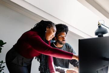 A female team leader provides constructive input to a colleague