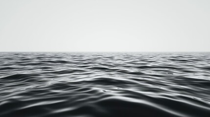 Naklejka premium Seascape abstract background concept. Serene view of calm ocean waves under an overcast sky, creating a tranquil atmosphere.