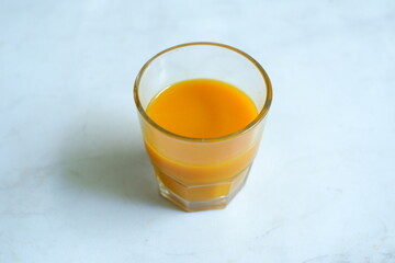 A glass of turmeric herbal drink 
