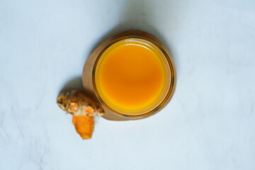 Glass of turmeric herbal drink 