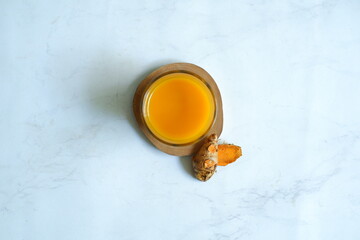 a glass of turmeric herbal drink 