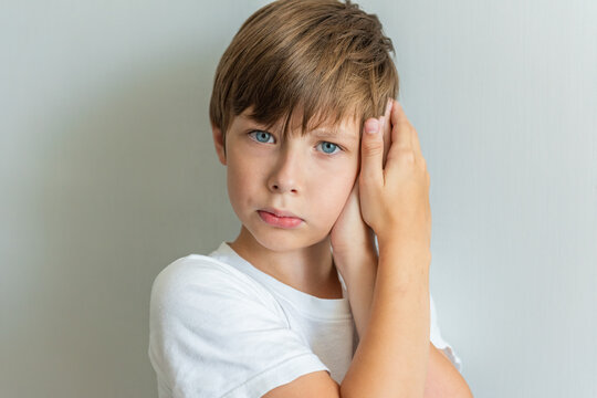 Child has an earache. The little child covered his ear with his hand. The child suffers from otitis. Ear diseases Eustachitis, Mastoiditis, cochlear neuritis, Otomycosis