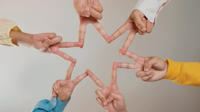 Startup company employee team gladly point finger assembly symbolize successful group of business partnership and strong collective unity teamwork in community workplace in panoramic video. Synergic