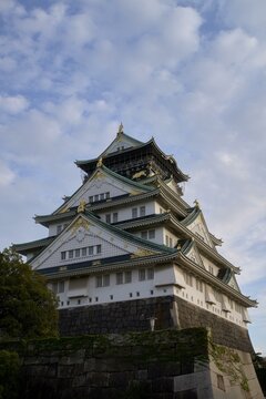 Majestic Osaka Castle standing tall under a vibrant sky