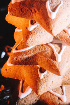 Holiday cookies shaped like stars stacked together for celebration