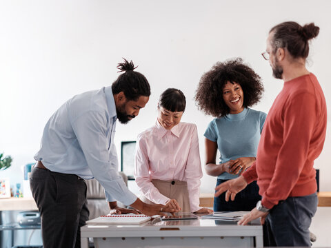 Modern Team Engaged in a Collaborative Workplace Discussion