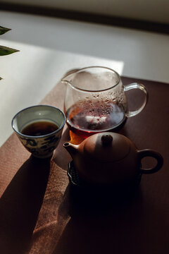 Still life with traditional Chinese pu erh tea in clay teapot.