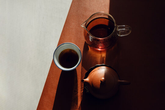 Still life with traditional Chinese pu erh tea in clay teapot.