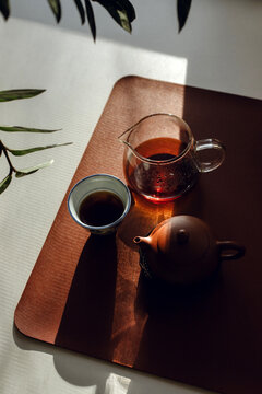 Still life with traditional Chinese pu erh tea in clay teapot.