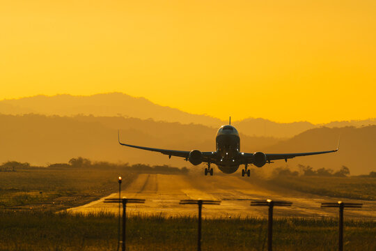 Airplane Taking Off in a Warm Sunset

