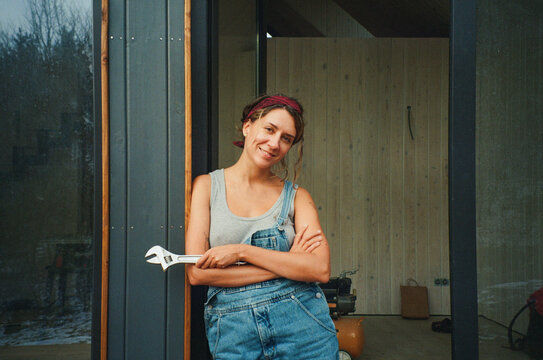 Empowered woman builder taking a break during construction project