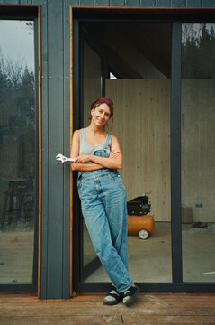 Empowered woman builder taking a break during construction project