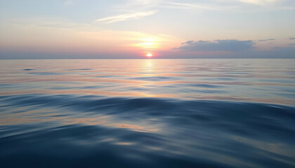 Obraz premium Serene Sunset Over Calm Ocean Waves with Colorful Reflections