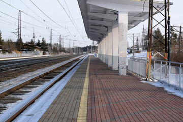 Empty passenger platform, winter station.
