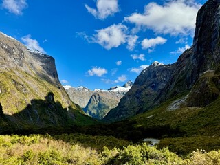 Milford Sound New Zealand snow capped mountains and valleys