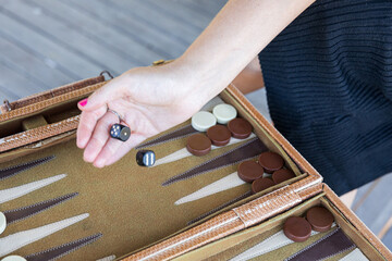 Player Ready to Roll Black and White Dice Pair in a Backgammon game