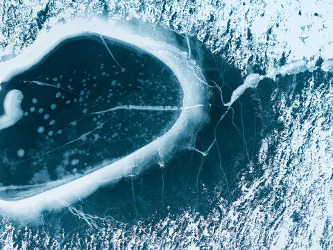 Close-Up of Ice Hole on Frozen Lake