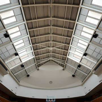 A view from below of the ceiling of the large school sports hall.