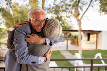 Elderly couple warmly embracing, symbolizing deep connection