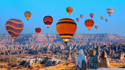 Naklejka premium Hot air balloon flying over spectacular Cappadocia - Goreme, Turkey