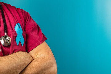 Healthcare worker in blue ribbons with stethoscope on blue background