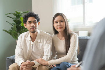 Spouses relationship consultant concept, Married couple listen to psychologist  during therapy talk session for married couple that mental health breakdown and relationship problems.