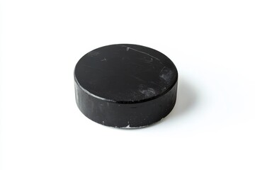 Isolated ice hockey puck on a clean white background with realistic lighting and sharp details