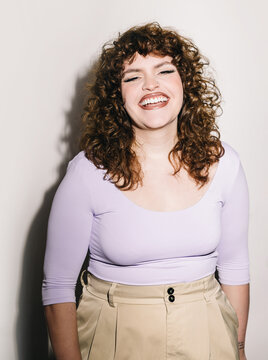 Curvy Woman in Lavender Top Radiating Genuine Joy