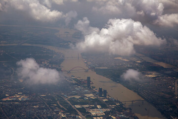 See the sky above big cities through the clouds