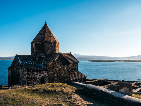 View of ancient buildings, Sevanavank Monastery on blue sky background. Historical churches and cathedrals at the northwestern shore of beautiful Lake Sevan in Gegharkunik Province of Armenia.