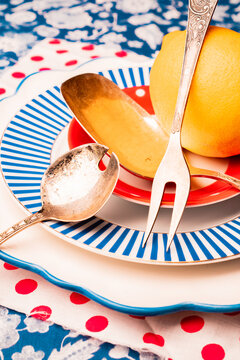 Colorful table setting with silverware and a lemon