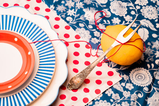 Art still life with lemon and plates.