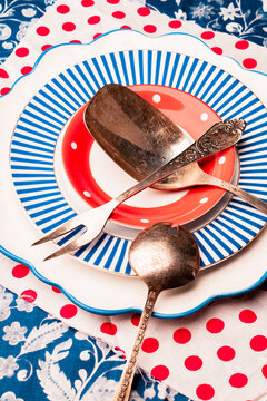 Beautifully arranged vintage tableware on a colorful setting