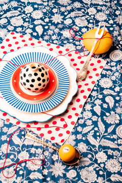 Colorful table setting with unique dishes and vibrant decor