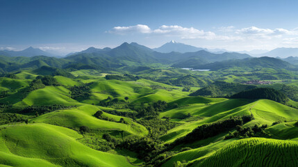 Fototapeta premium A stunning green valley surrounded by majestic mountains in the background showcasing rural landscapes for photography