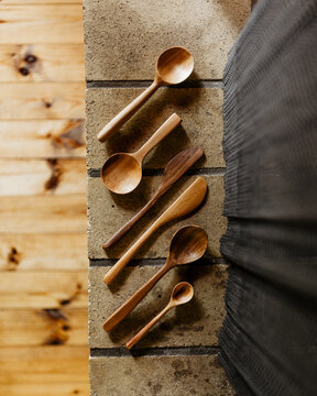 a set of hand carved wooden utensils