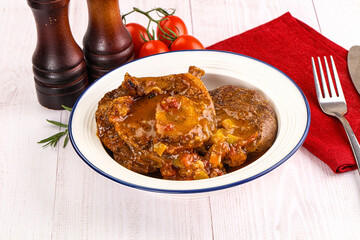 Italian cuisine - ossobuco with sauce