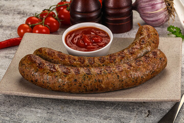 Grilled beef sausages with sauce