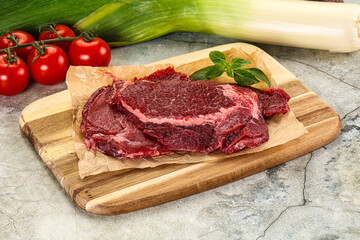 Raw beef cheeks cut for cooking