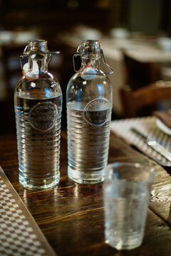 Two glass bottles filled with water