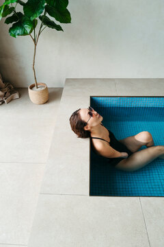 Relaxing Moments in a Serene Indoor Pool Setting