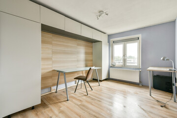 A stylish modern room featuring minimalist design elements, light wood accents, and a spacious layout ideal for productivity and relaxation.