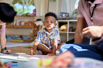 Little boy coloring at daycare