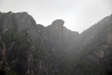 Predigtstuhl in the Lysefjord emerges from the fog, Norway