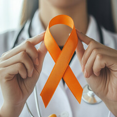 Woman doctor with orange ribbon for Leukemia. High quality photo