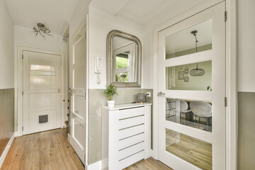 A stylish modern hallway showcasing elegant decor, sleek furniture, and natural light, creating a welcoming atmosphere in a contemporary home.