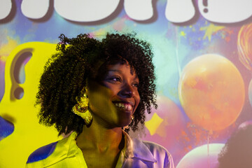 Vibrant Portrait with Colorful Projection on Smiling Woman