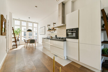 Stylish and spacious kitchen featuring sleek cabinetry, bright natural light, and a minimalist design that promotes functionality and elegance.