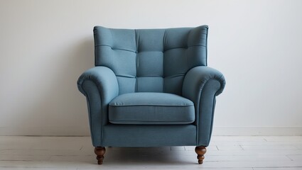 Light blue armchair with tufted upholstery centrally positioned against a plain white background highlighting its vintage charm and wooden legs.