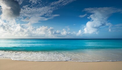 Fototapeta premium cobalt sea softly laps at a sandy shore beneath a tranquil cloud filled sky